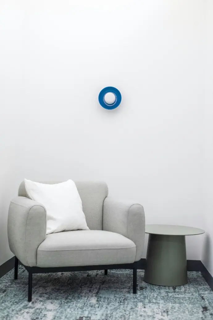 blue round ball on grey sofa